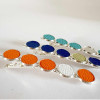 Barrette pince avec puces de cuir de couleur sur base argentée